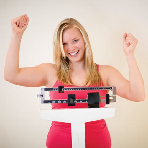 Pain Management Plantation FL Woman on Scale Cheering Pain Management Plantation FL Woman on Scale Cheering